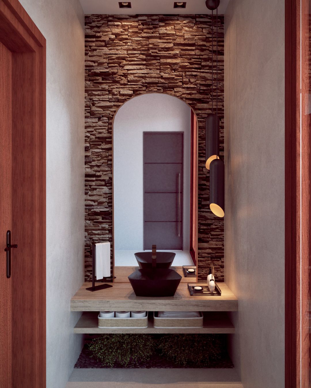 Lavabo com revestimento em pedra natural, espelho com arco, bancada amadeirada em balanço e cuba de apoio escura — projeto em Ouro Preto