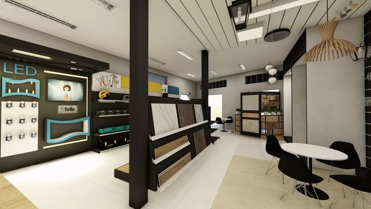 Interior de loja de materiais de construção com expositor de revestimentos em cavalete, painel de iluminação com recortes azuis e área de atendimento com pendentes no Bauxita